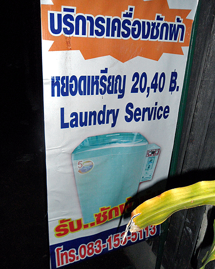 Sign for cheap laundry service in Thailand