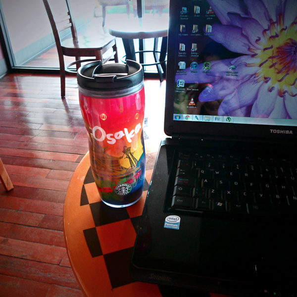 Osaka Starbucks Coffee Mug next to laptop in Chiang Mai
